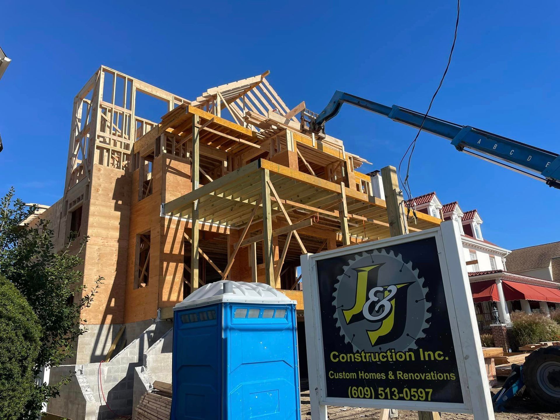 A construction site with a sign for j & j construction inc.