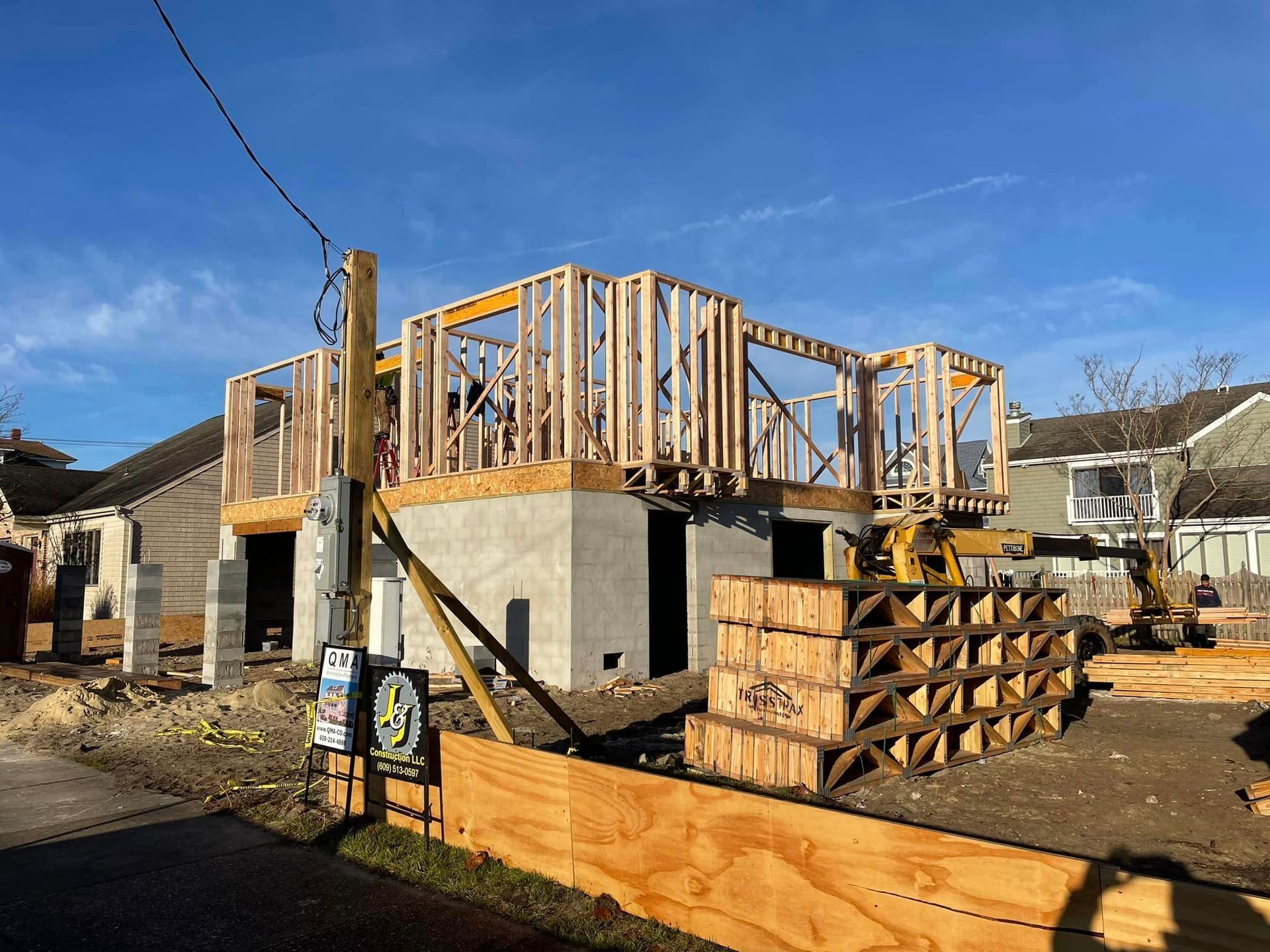 A house is being built in the middle of a residential neighborhood.