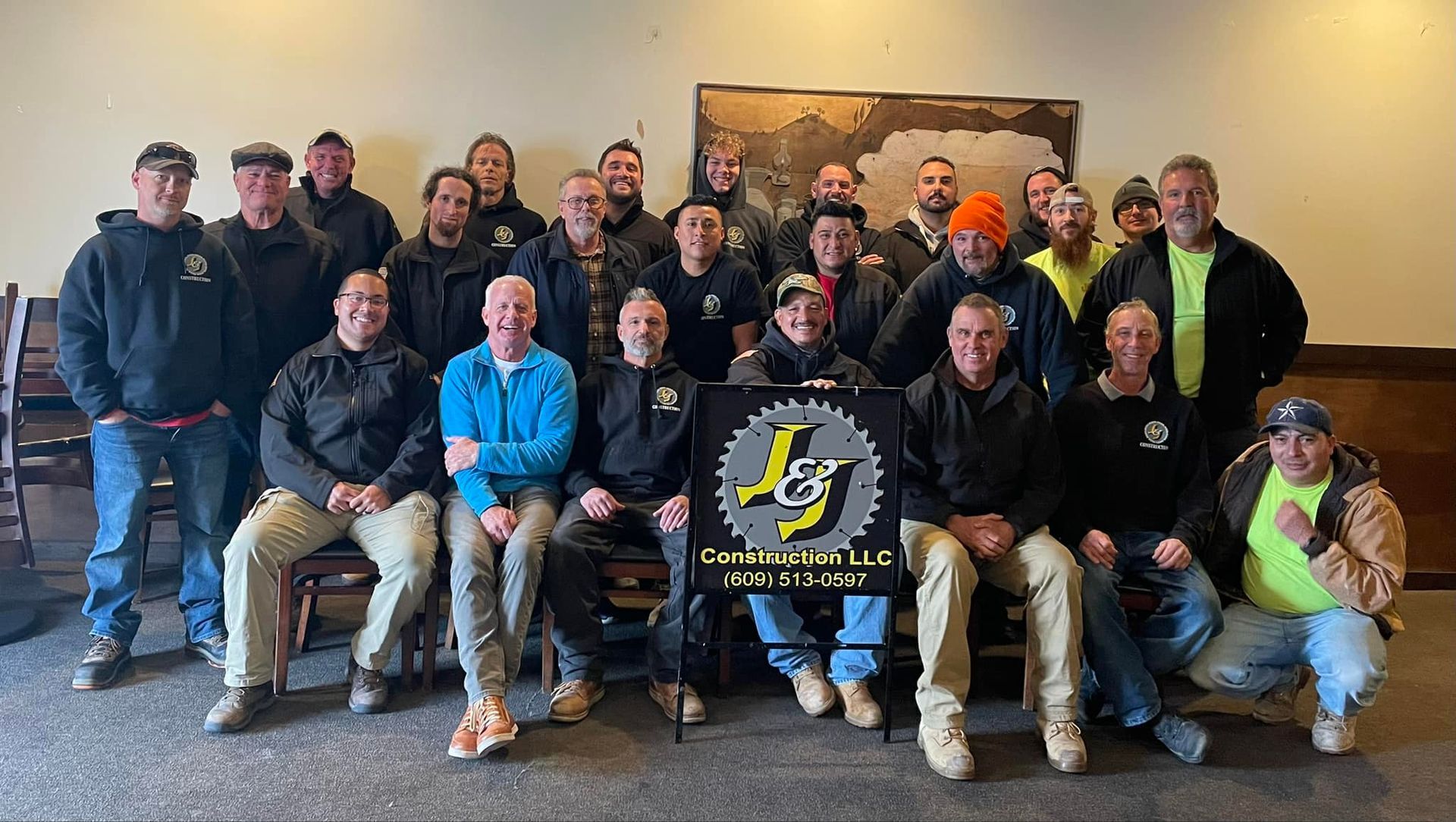 A group of men are posing for a picture in a room.