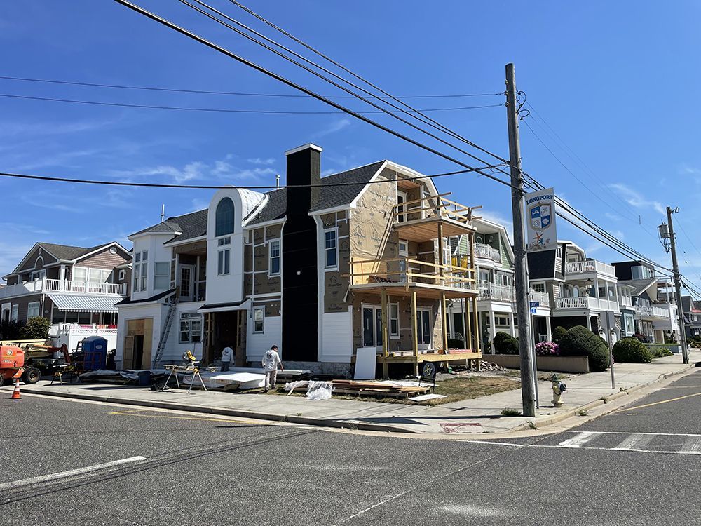 A house is being built on the corner of a street.
