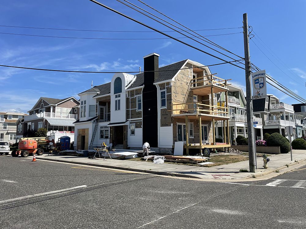 A house is being built on the corner of a street.
