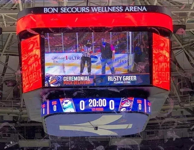 Bon Secours Wellness Arena jumbotron showing a ceremonial hockey faceoff and 20:00 on the clock