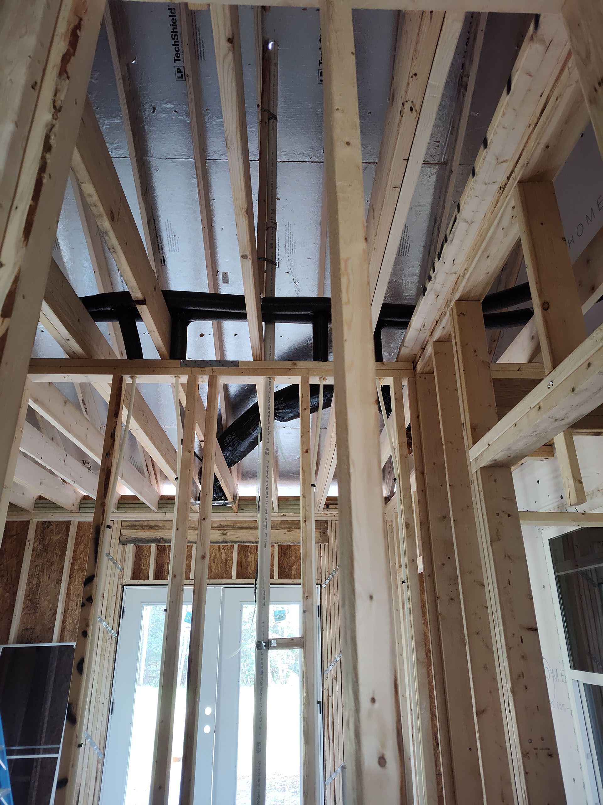 Looking up at the ceiling of a house under construction.