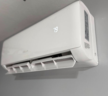 White wall-mounted air conditioner unit showing a temperature display of 79 degrees.