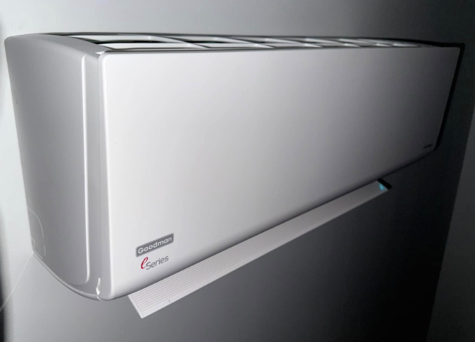 Silver wall-mounted air conditioner.