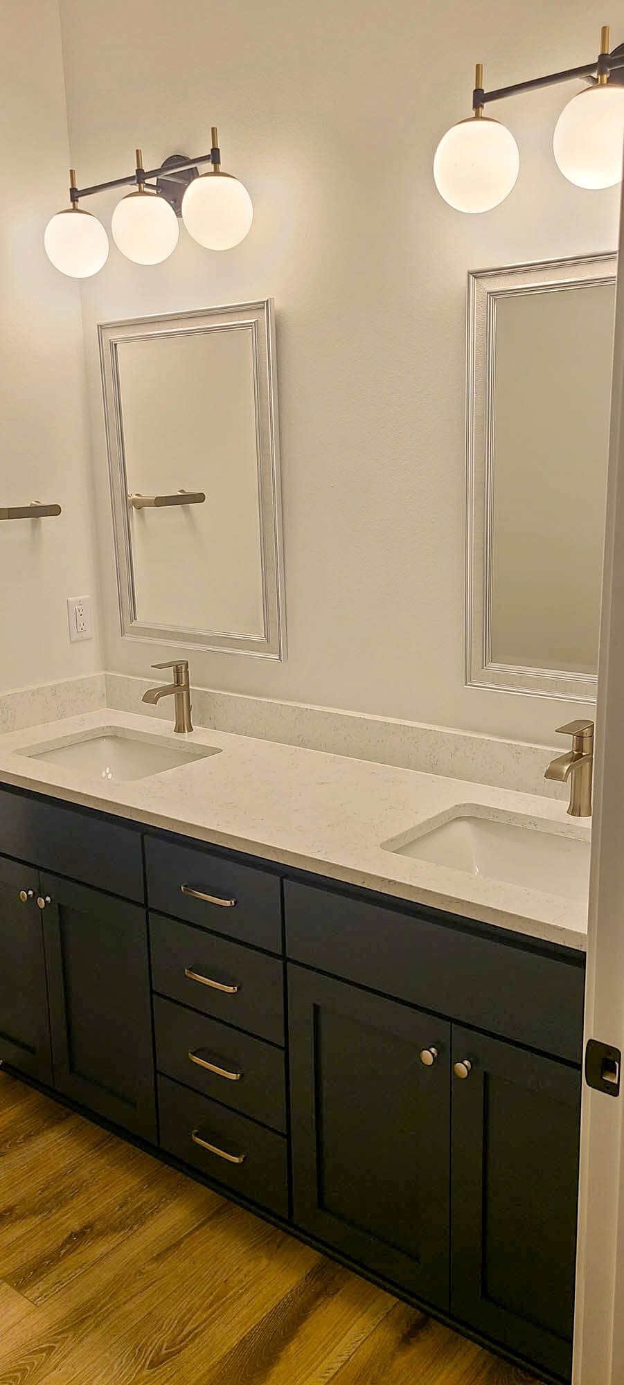 Bathroom with sink and mirrors