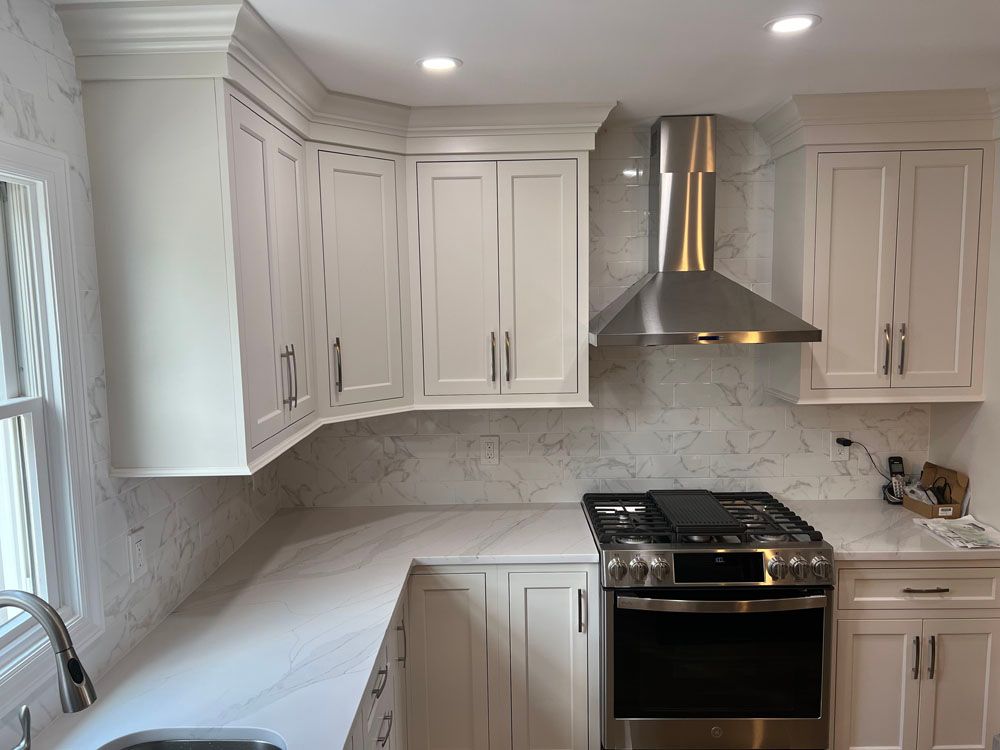 a kitchen with white cabinets