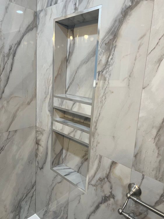 a bathroom with marble walls