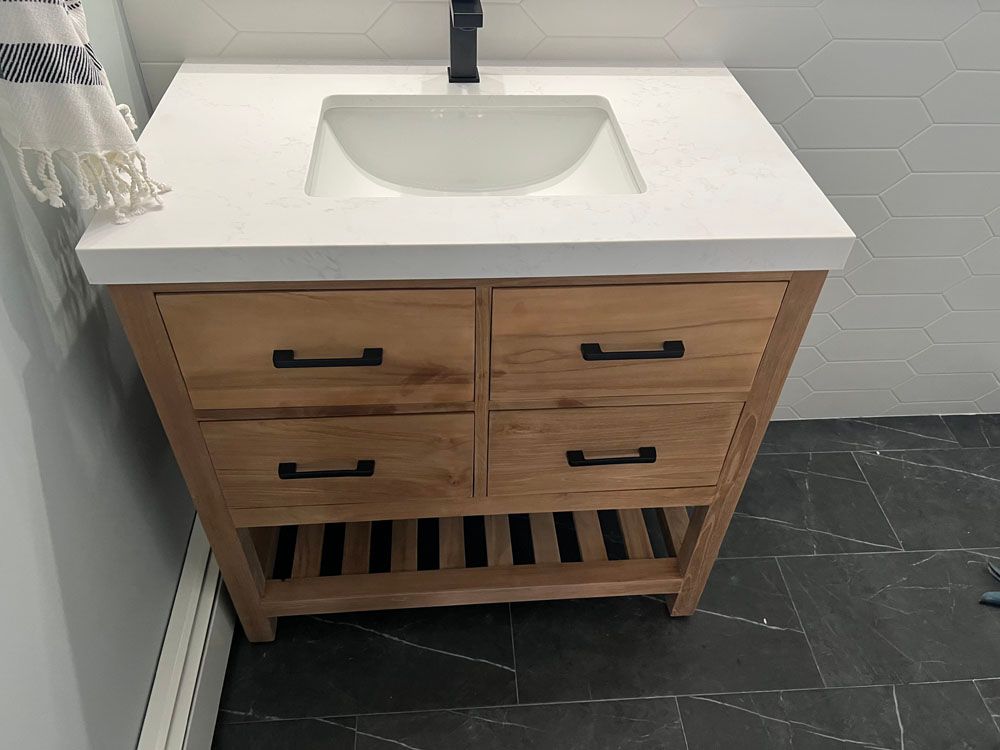 a bathroom vanity with a sink and drawers