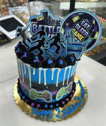A cake that says eat sleep game on it