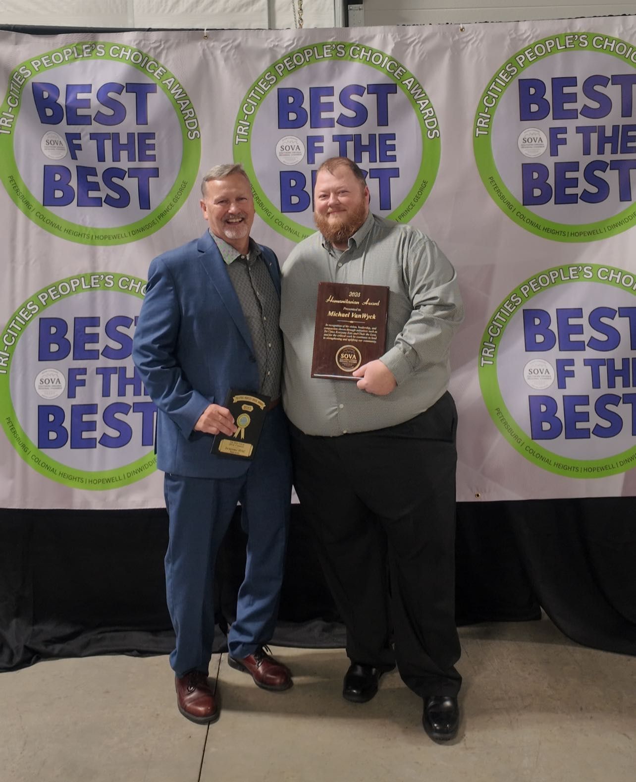 Two men holding a light blue