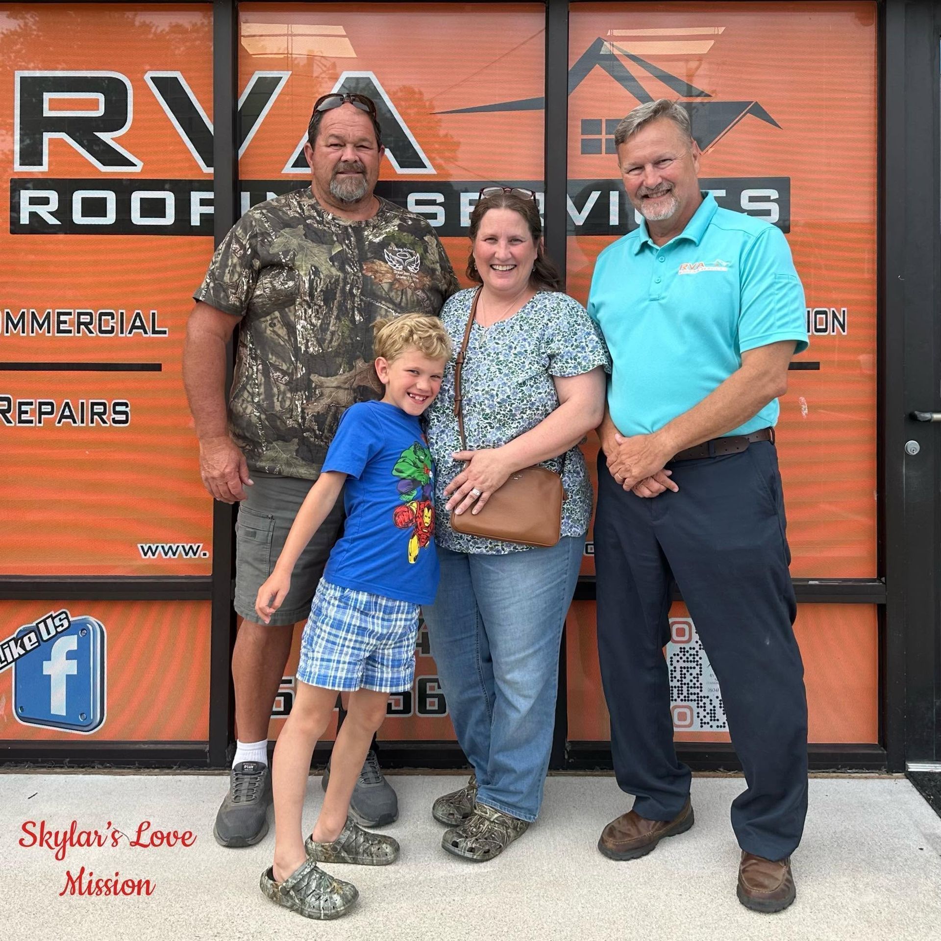 Family posing outside an RV repair shop in front of an orange door and logo.