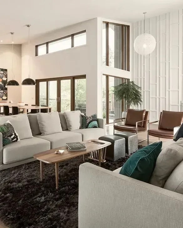Modern living room with neutral colors, large windows, and contemporary furniture.