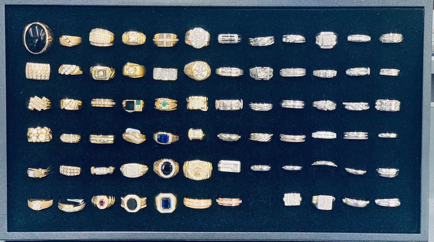 A display case filled with many different types of jewelry