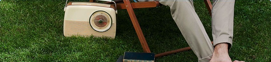 Vintage radio and books on the grass