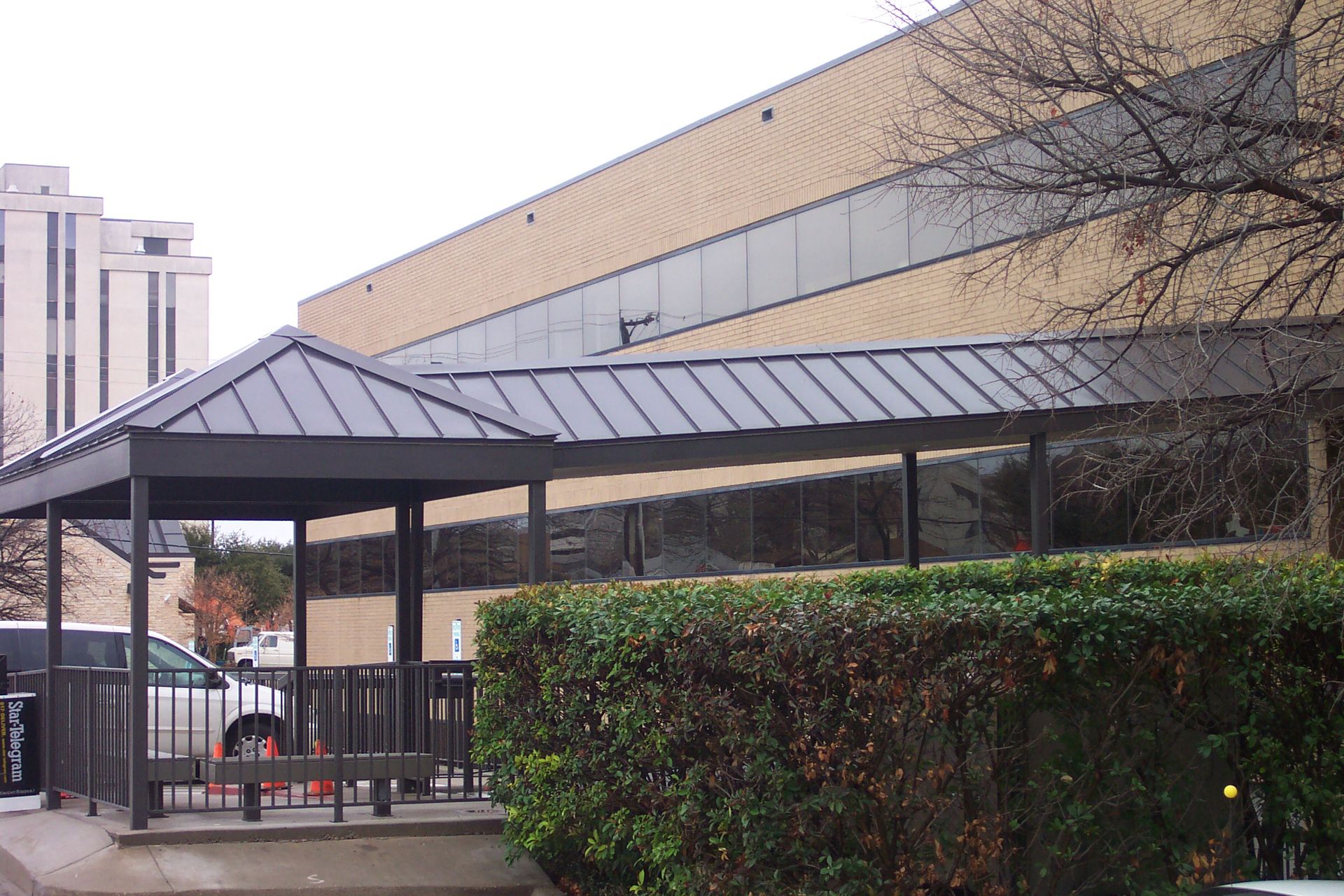 A building with a covered walkway leading to it