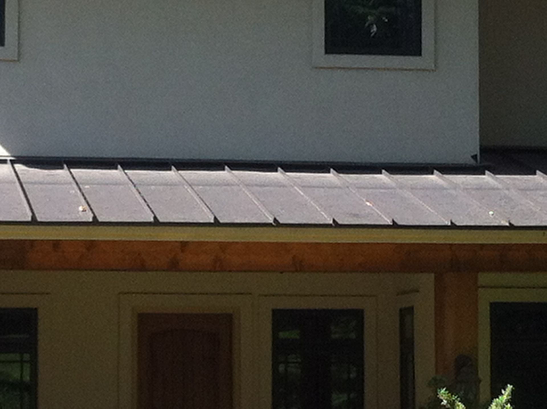 A house with a roof that is covered in shingles