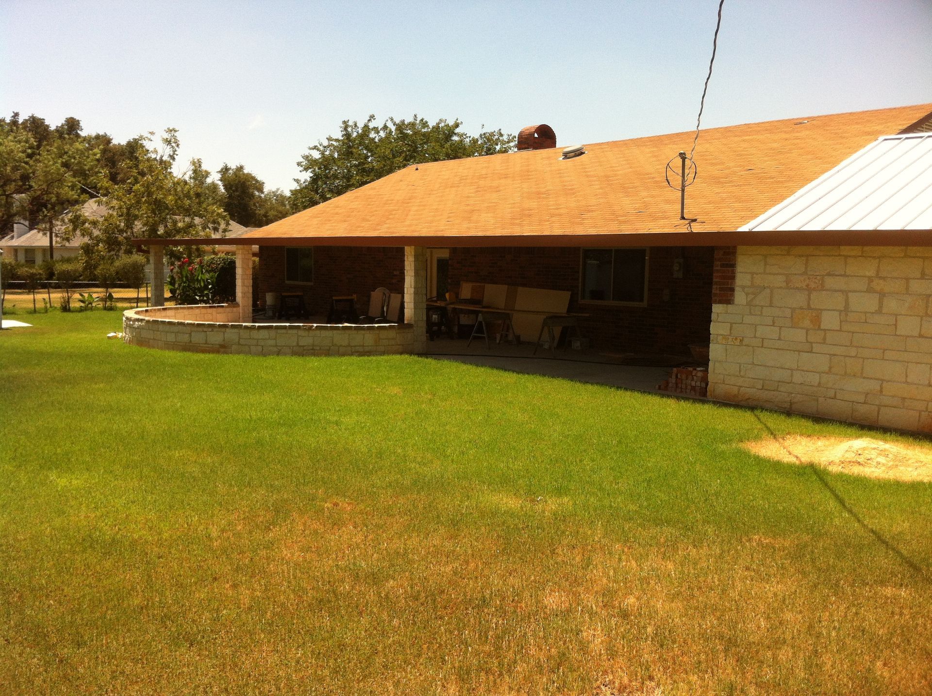 A house with a brown roof and a white roof