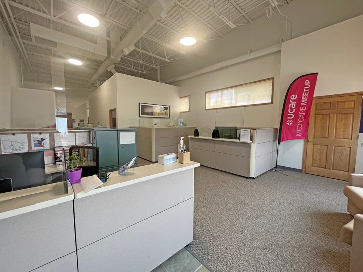 A large office with a flag that says eucare on it.