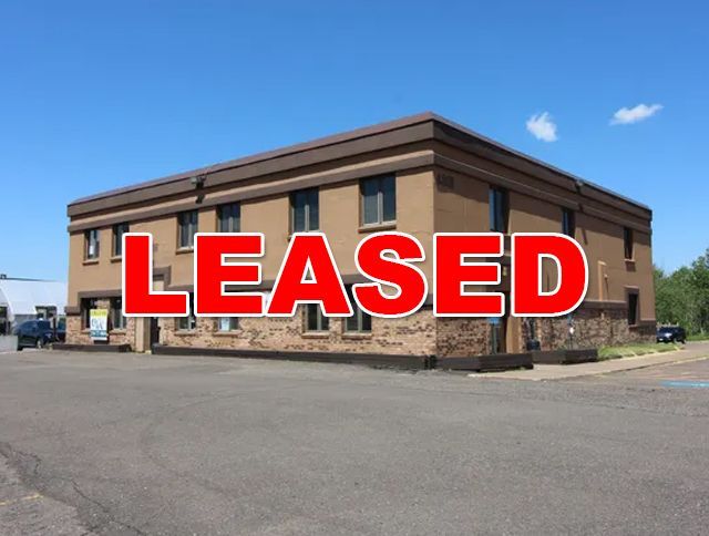 a large brown building with a lot of windows