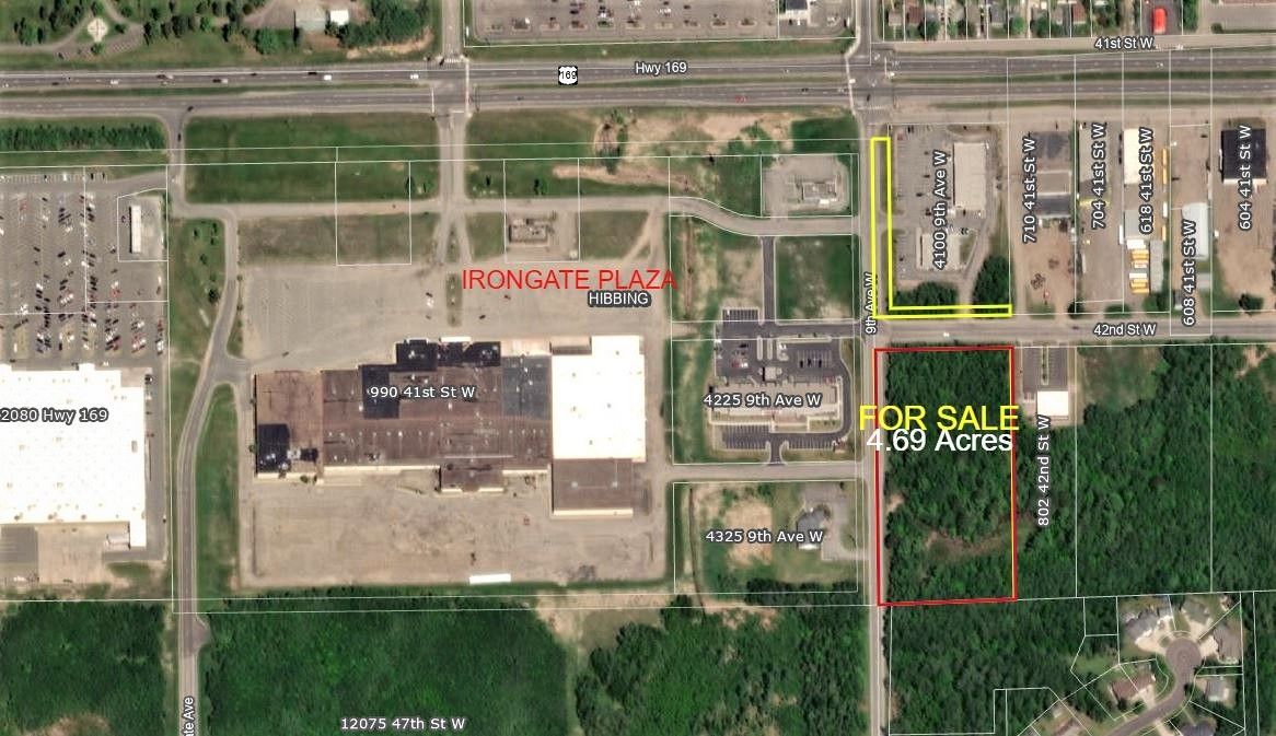 an aerial view of a city with a lot for sale