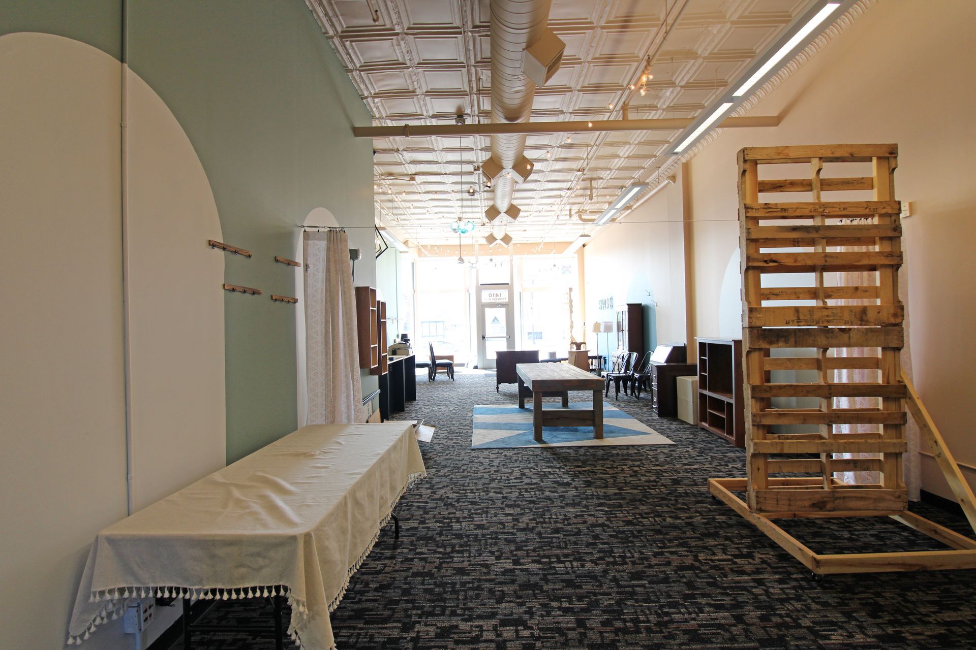 a large room with a table and chairs in it