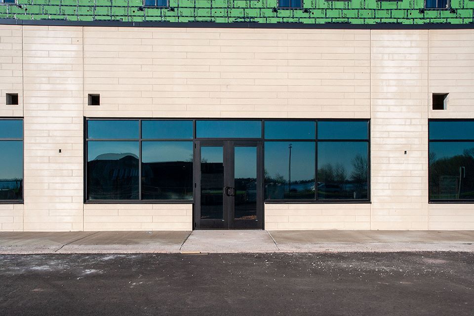 a building under construction with a lot of windows and a door .