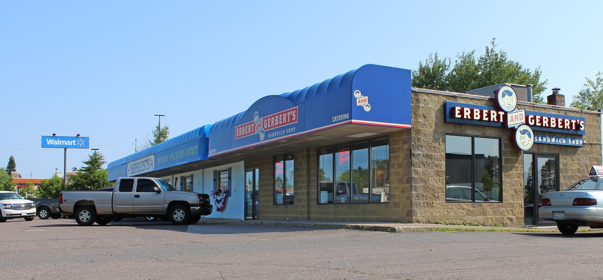 a truck is parked in front of a store