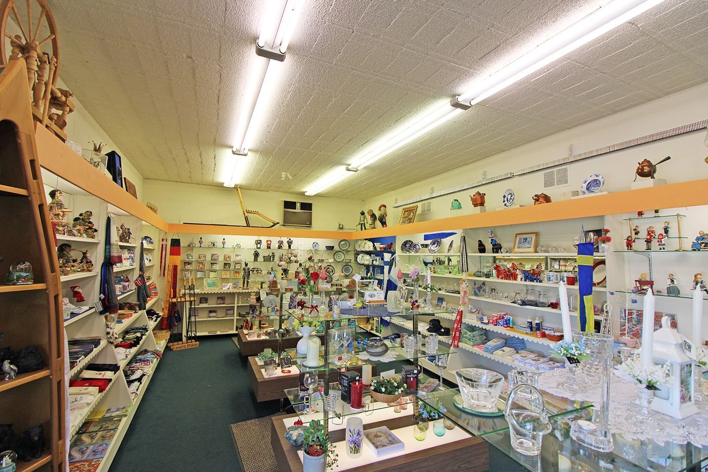 a store filled with lots of items and a staircase