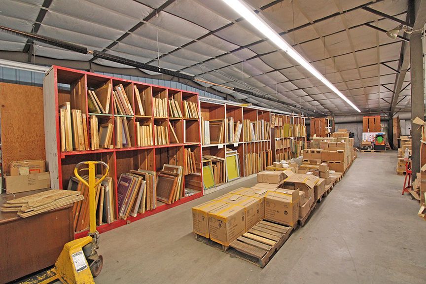 a large warehouse filled with lots of boxes and shelves