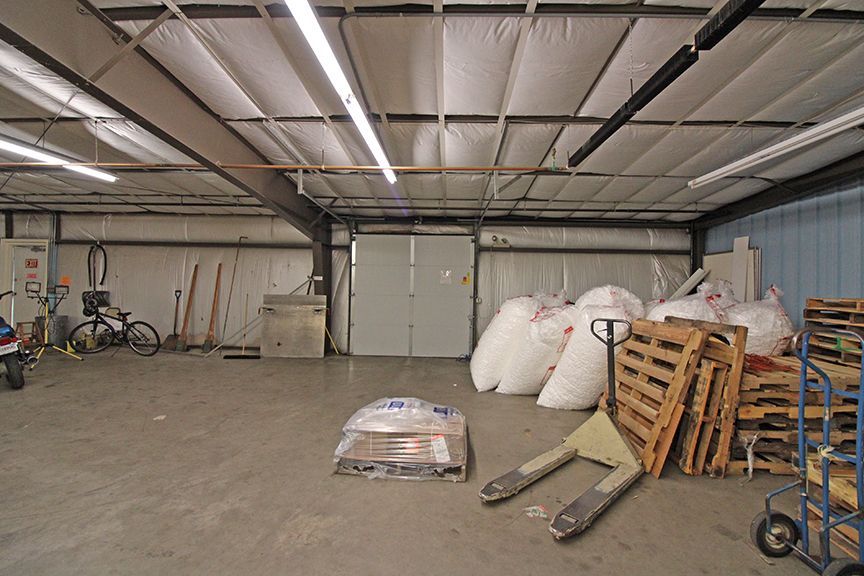 a warehouse filled with lots of bags and pallets