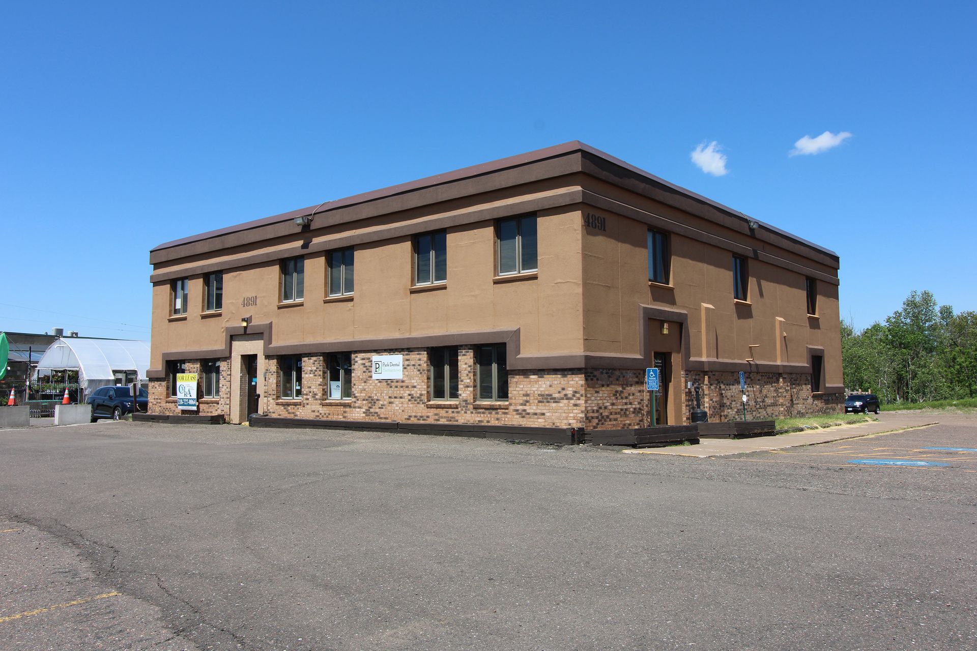 a large brown building with a lot of windows