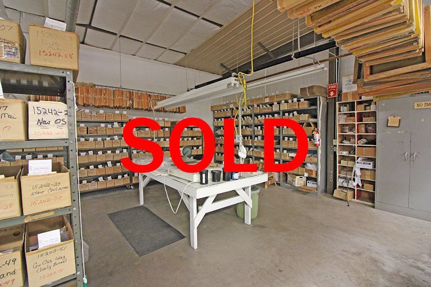 a large room with lots of shelves and boxes on them