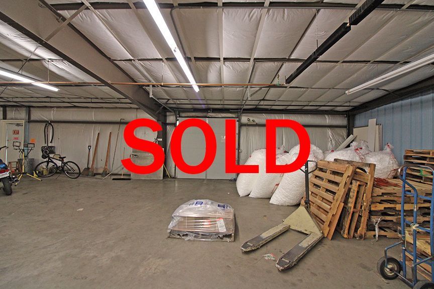a warehouse filled with lots of bags and pallets
