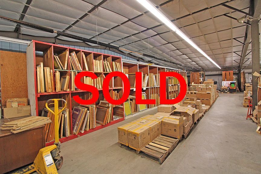 a large warehouse filled with lots of boxes and shelves