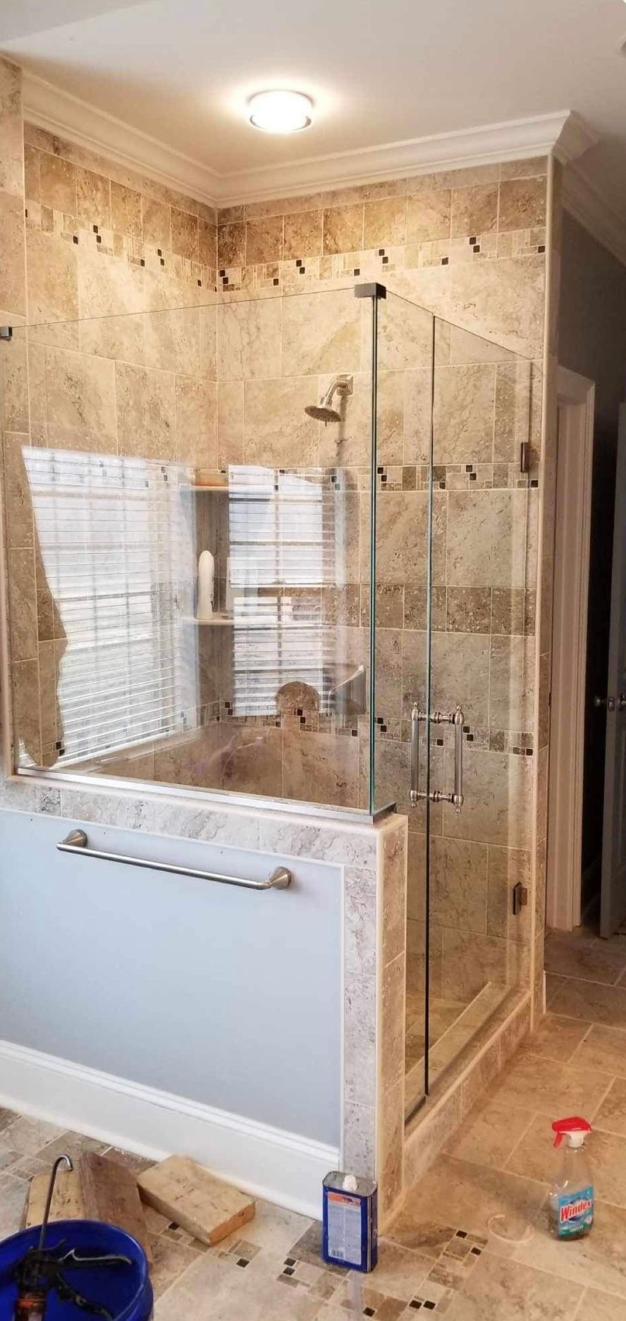 a bathroom with a bathtub and a shower stall