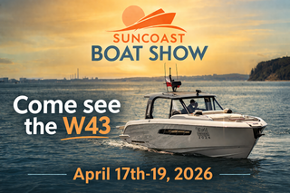 A white boat on water at sunset advertising the Suncoast Boat Show, happening April 17th-19th, 2026, featuring the W43.
