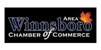 Winnsboro Area Chamber of Commerce logo on black background with blue and white text and a red sunburst.