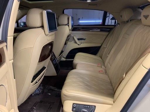 The back seat of a bentley continental gt is shown.