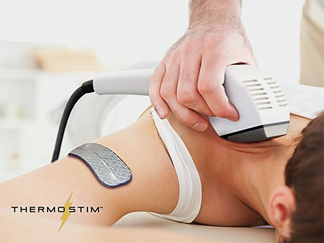 A woman is getting a treatment from a thermostim machine