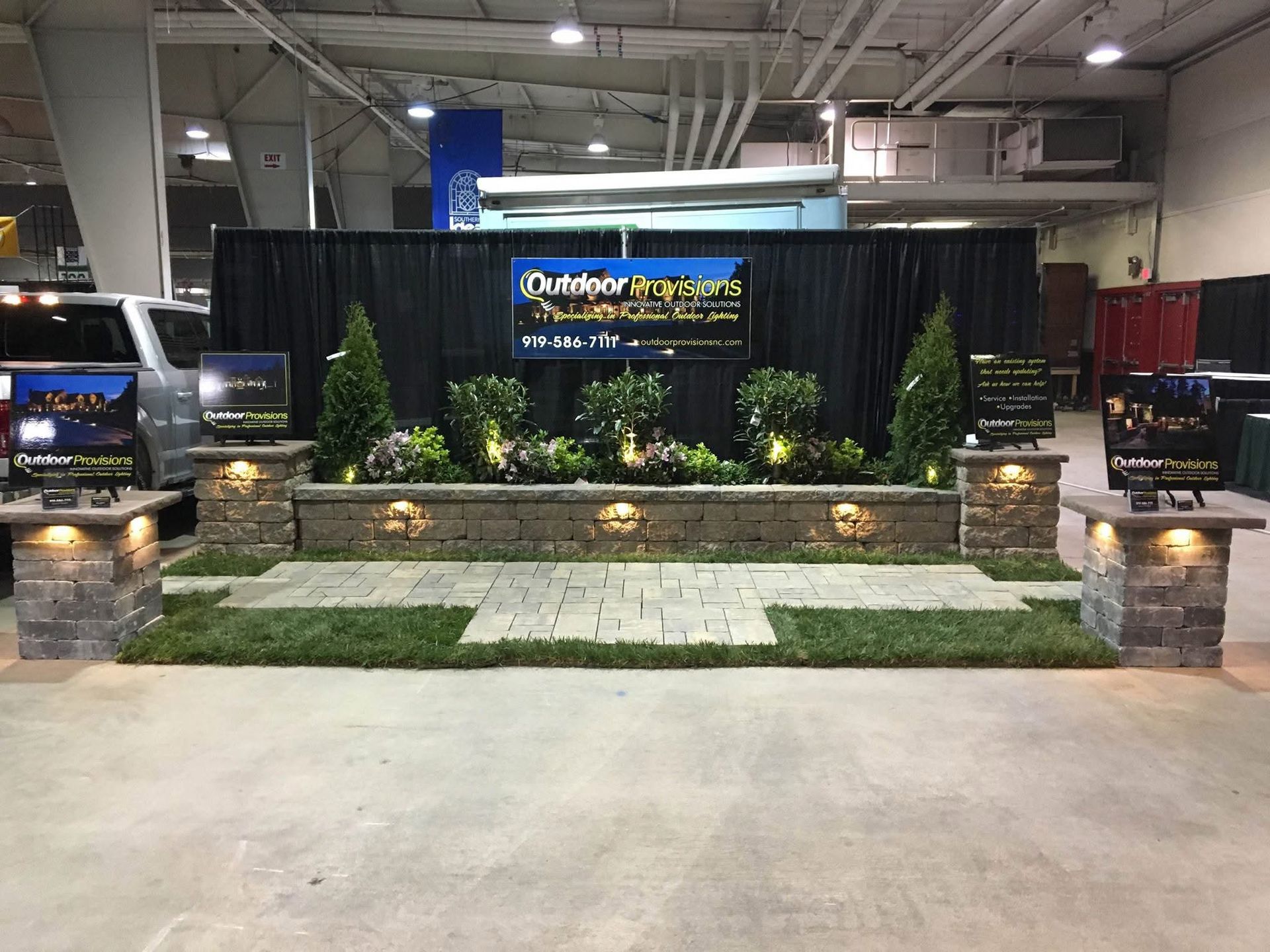 an Outdoor Provisions booth in a large room