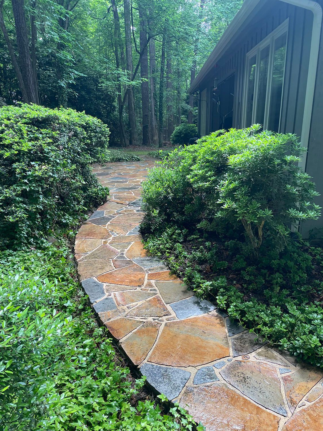 A stone walkway that has undergone pressure washing.