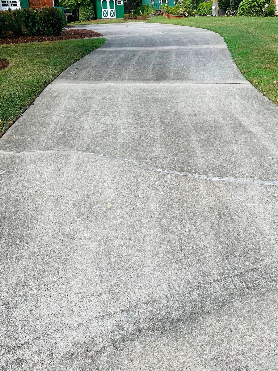 A newly cleaned concrete driveway