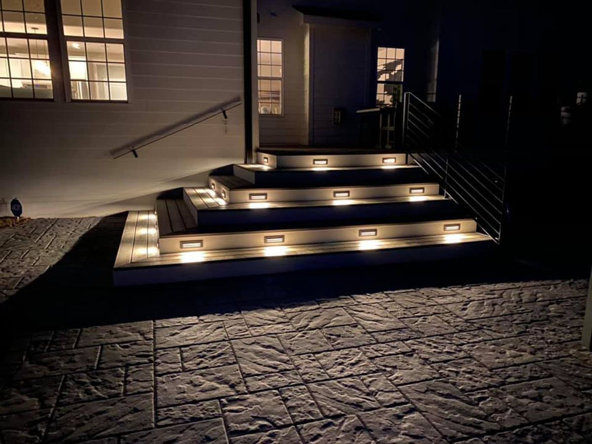 A beautiful set of stairs that are lit up at night