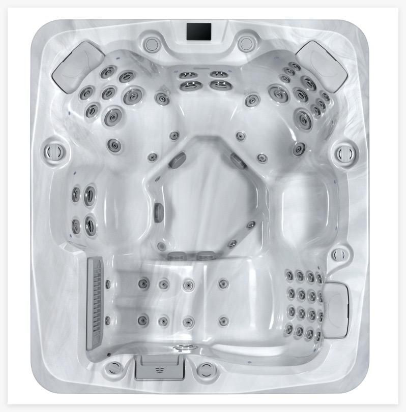 White square hot tub with multiple black massage jets and seats, viewed from above.