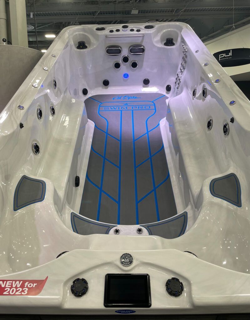White carbon-fiber luxury boat interior with blue accent lighting and quilted deck flooring