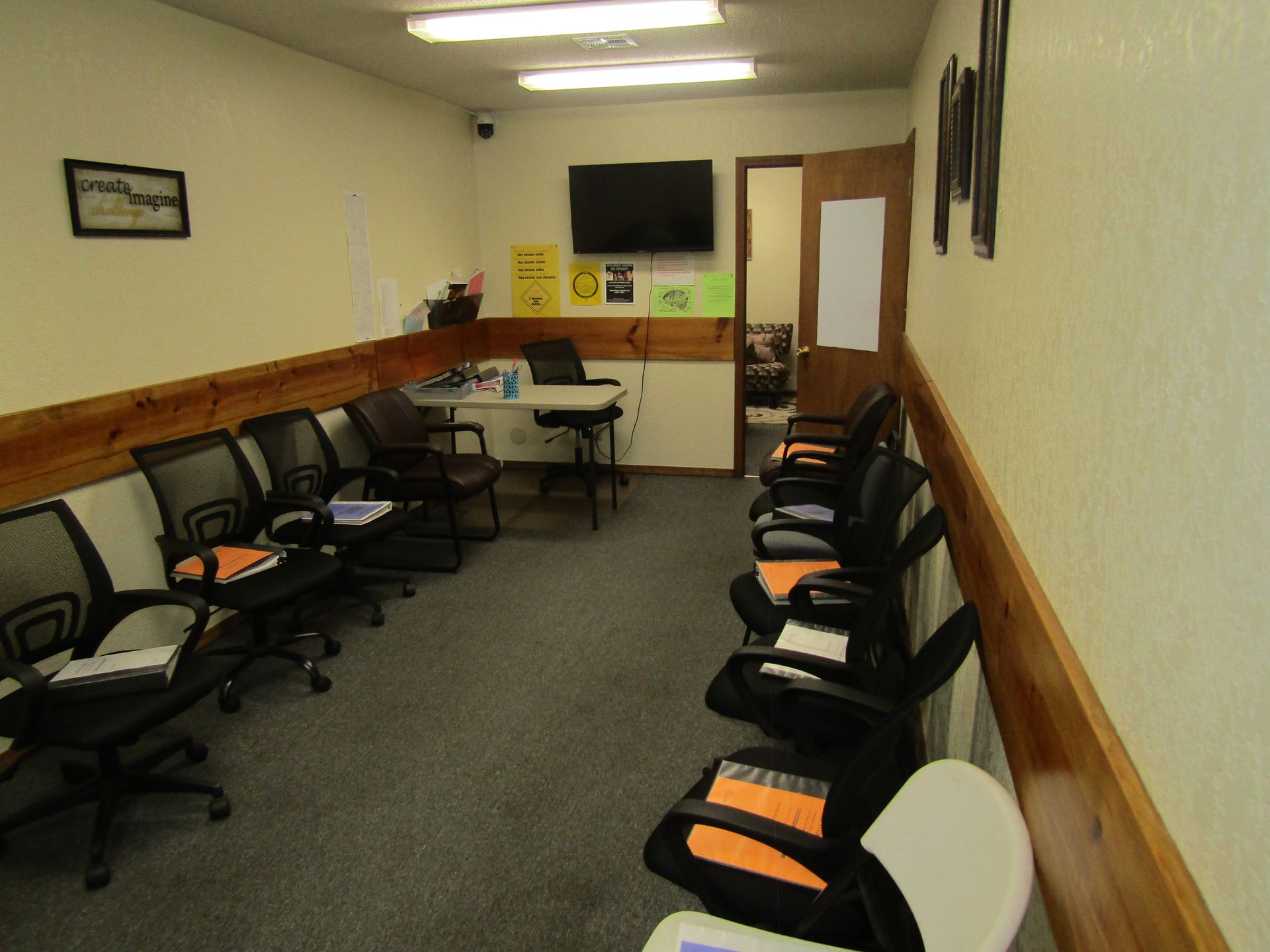 An empty basement with shelves and a door