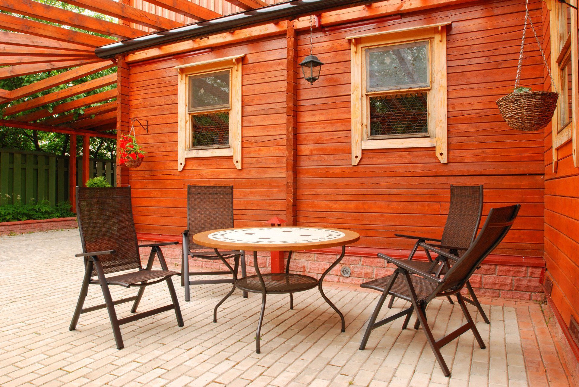 Wooden pergola with chairs and table
