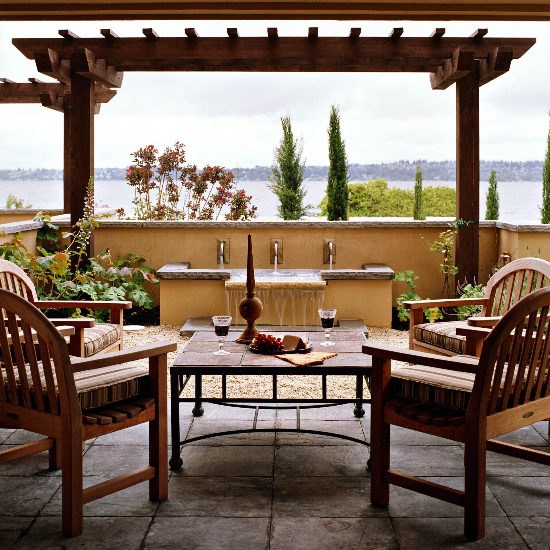 Wooden chairs and table with pergola