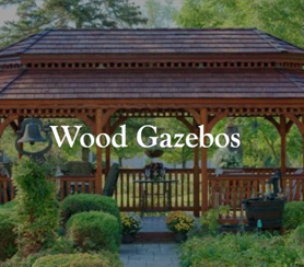 A wooden gazebo surrounded with plants